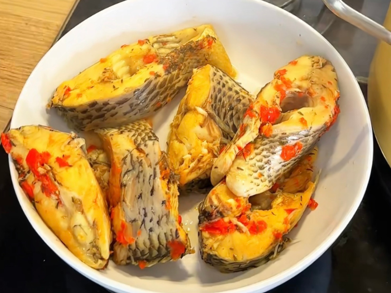 fish in a plate spice with scotch bonnet pepper and thyme