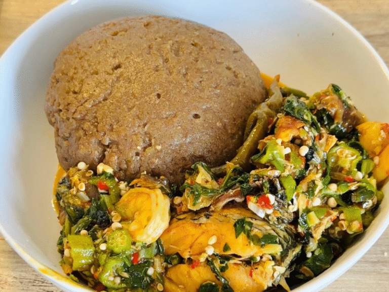 Hot okro soup served with eba and pounded yam for the perfect Nigerian meal