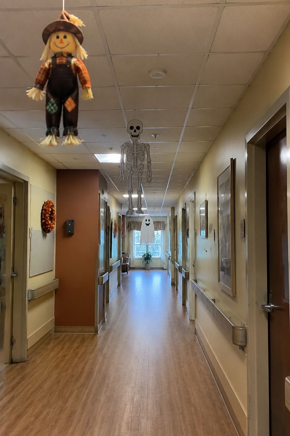 halloween-decor-assisted-living-hanging-ghosts-skeletons-ceiling